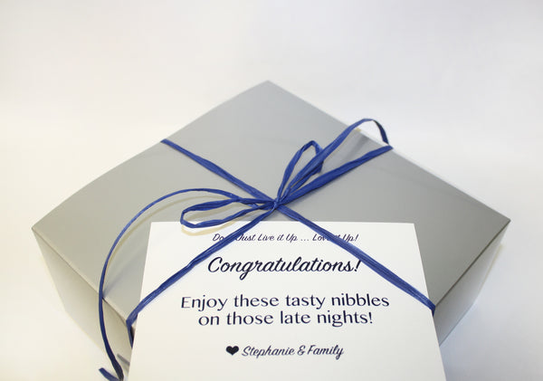 Chocolate Chip Cookie gift box in silver with blue ribbon and personalized card