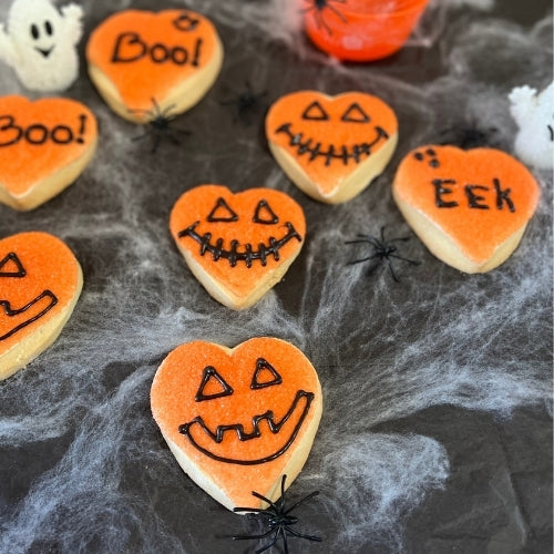 Pumpkin faced sugar cookies. natural and organic ingredients. Guittard white and dark chocolate. Gift wrapped. 